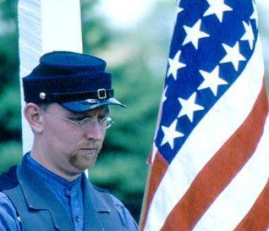 Wade Franck carrying a flag at Decoration Day celebration