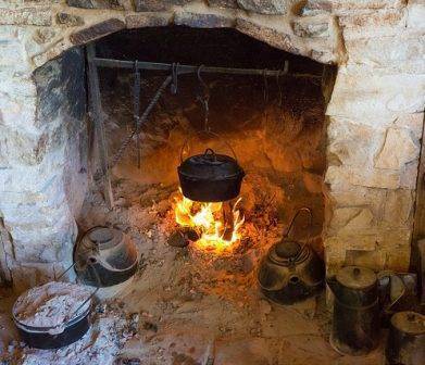 cast iron pot over an open hearth fire
