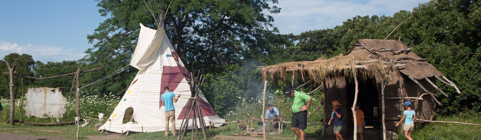 museum guests with tipi and bark lodge at 1700 Ioway farm