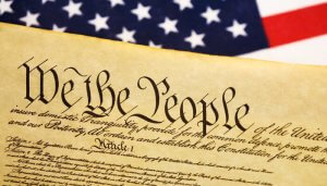 graphic of u.s. flag and first few handwritten lines of Declaration of Independence